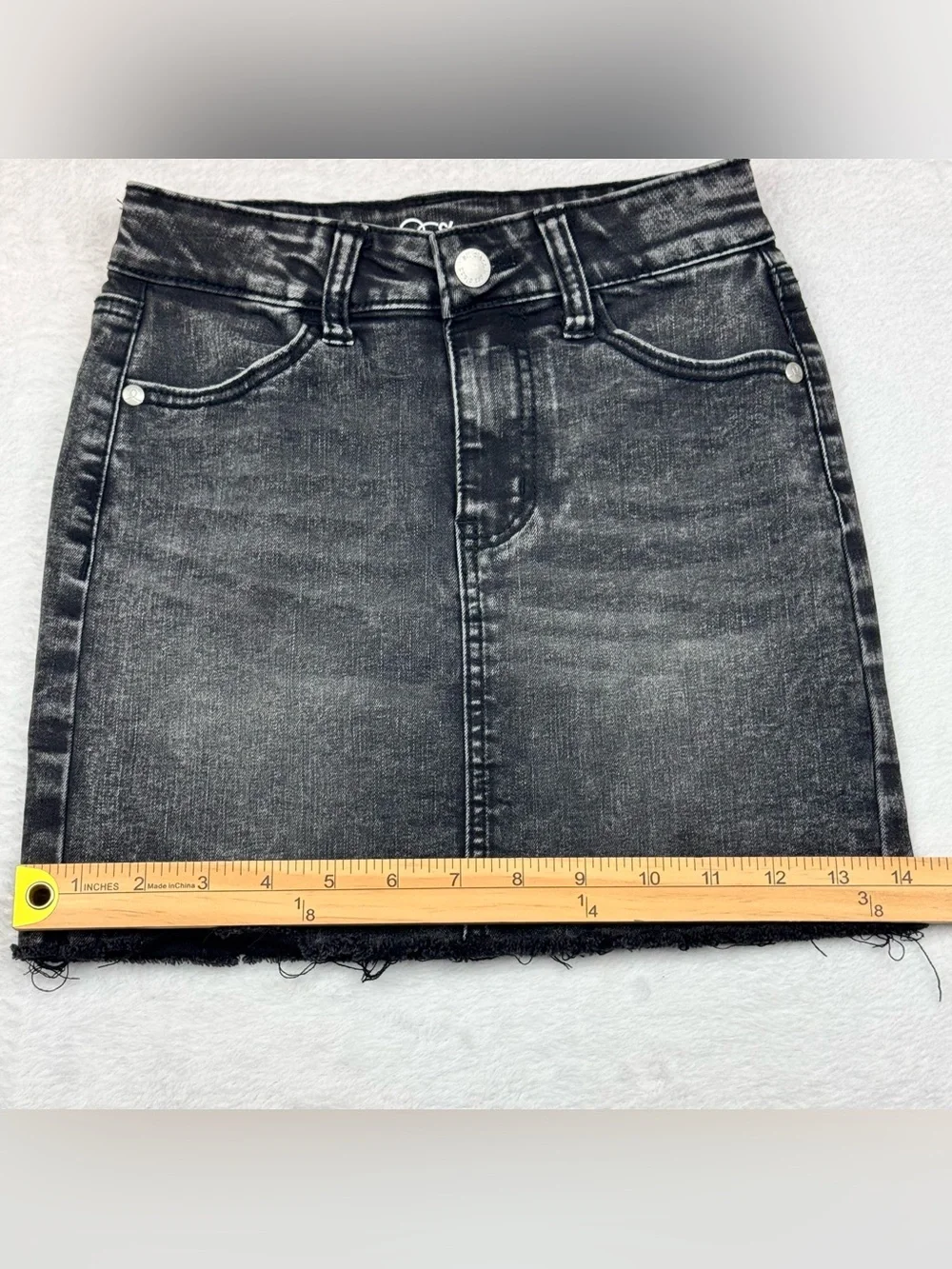 Lot of 2 girls denim skirts. The blue shirt is a size 8, black skirt is size 7/8